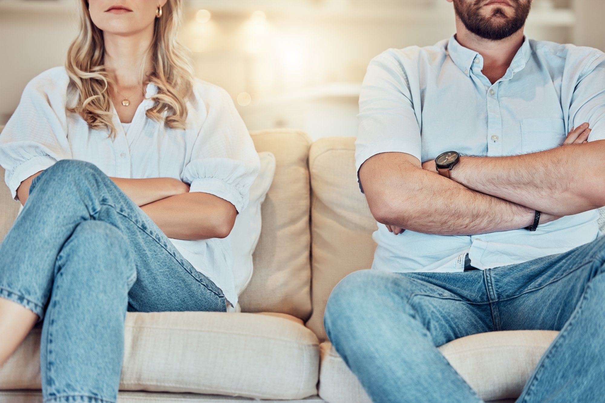 PS RE COUPLE crossed arms on couch