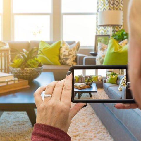 Woman taking real estate video